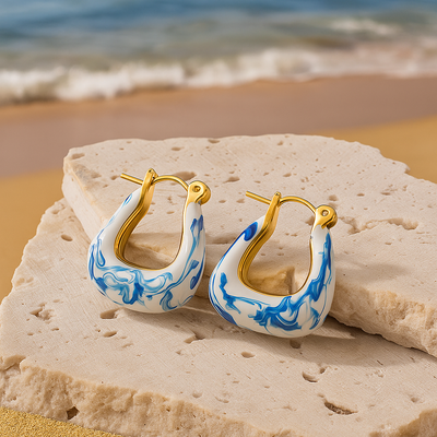 Kaïra | Boucles d'oreilles en mousse dorée ondulée